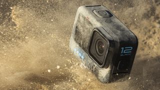 GoPro Hero 12 Black emerging in a dusty terrain