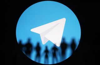 Telegram logo with a black circular border seemingly placing a spotlight on the company