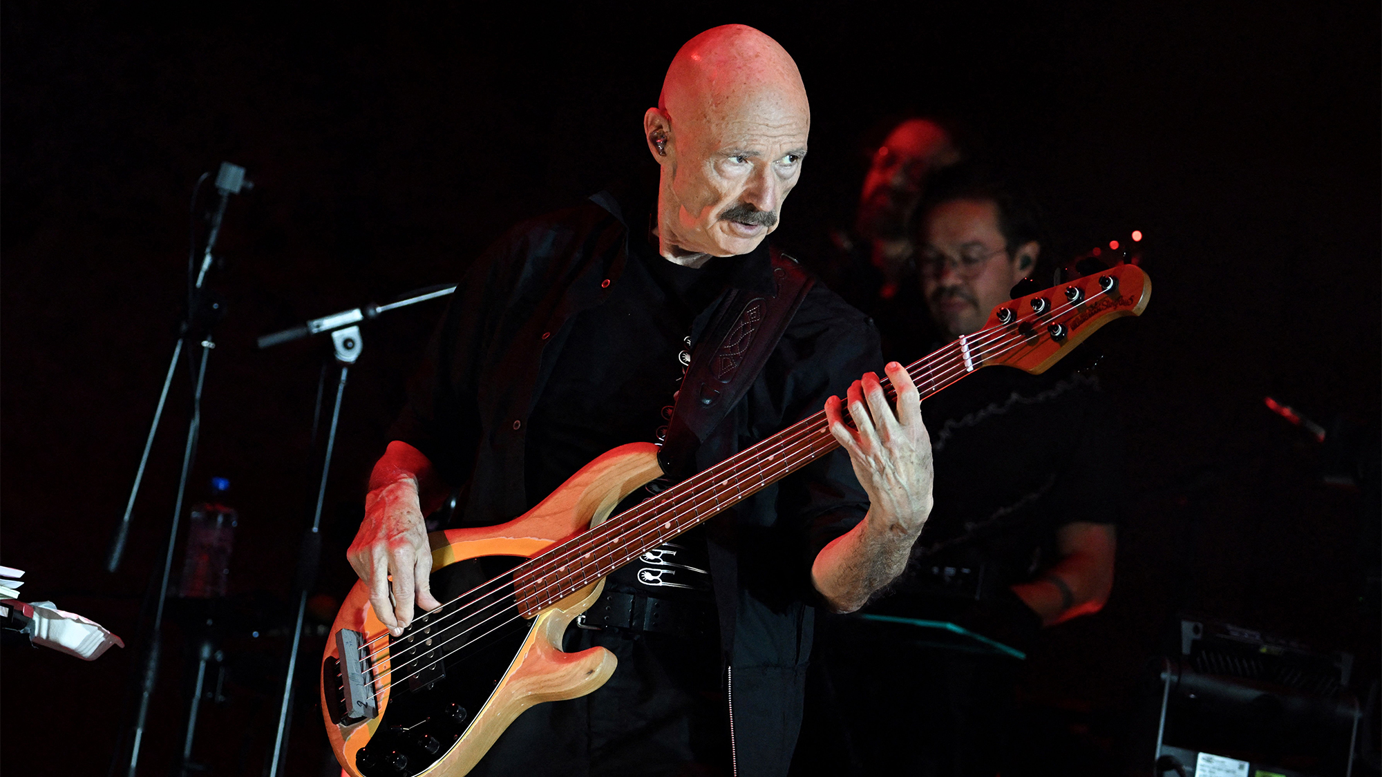 Tony Levin performs on stage with English musician Peter Gabriel (unseen) during a concert at the Accor Arena in Paris, on May 23, 2023.