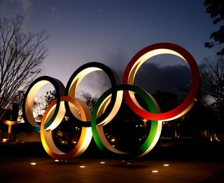 Olympic Rings are seen near the National Stadium, the main venue for the Tokyo 2020 Olympic and Paralympic Games, in Tokyo on January 8, 2021, as Tokyo Olympics organisers insisted that the coronavirus-postponed Games will still go ahead despite Japan declaring a state of emergency less than 200 days before the opening ceremony. (Photo by Behrouz MEHRI / AFP) (Photo by BEHROUZ MEHRI/AFP via Getty Images)