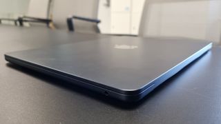 MacBook Air laptop in an office on a black desk