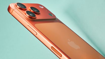 Apple iPhone 17 Pro in cosmic orange on green background