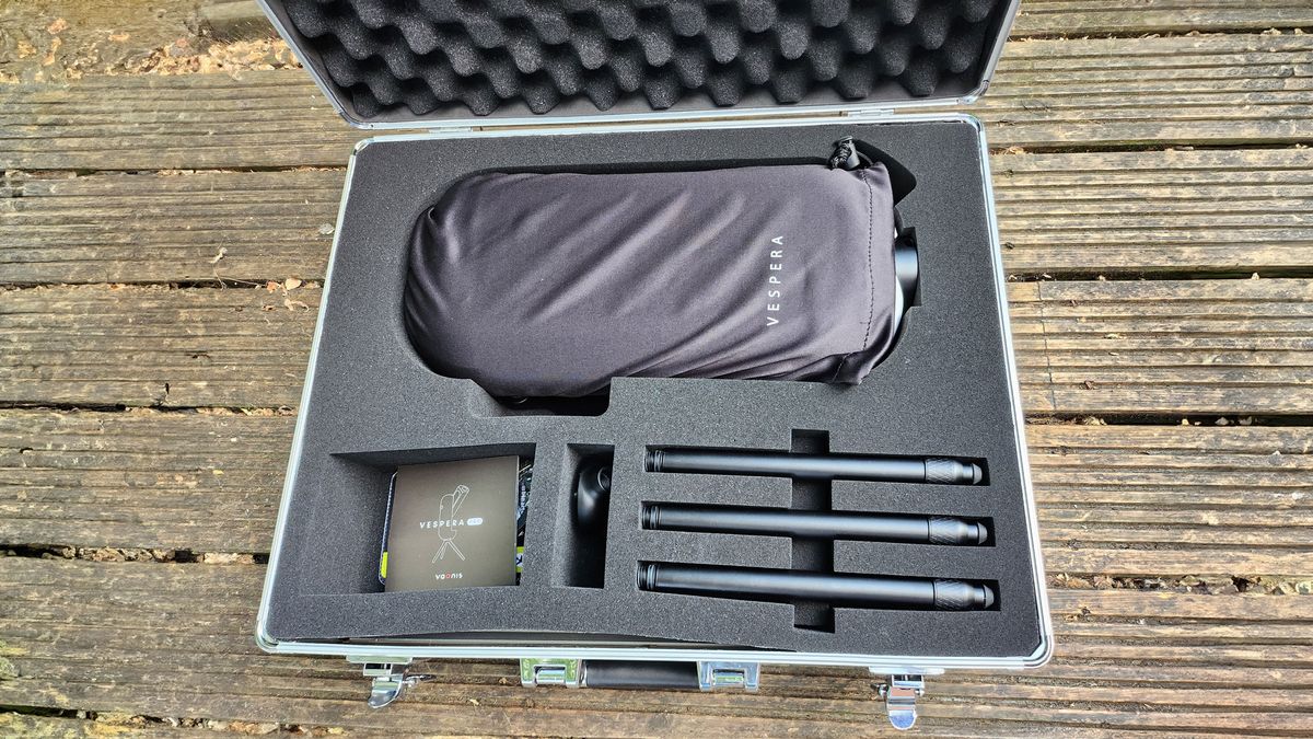 A closeup of inside the Vaonis Vespera Pro carry case showing Vaonis Vespera Pro, tripod parts and instruction booklet.