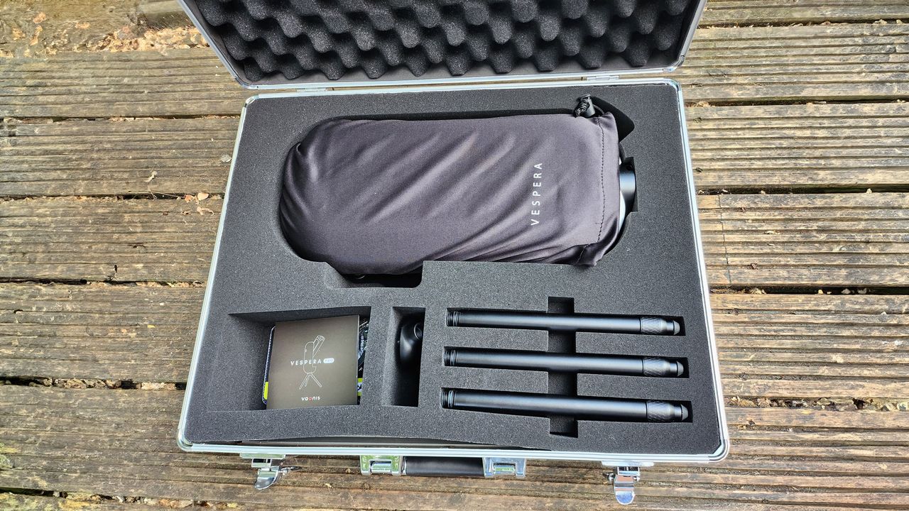 A closeup of inside the Vaonis Vespera Pro carry case showing Vaonis Vespera Pro, tripod parts and instruction booklet.