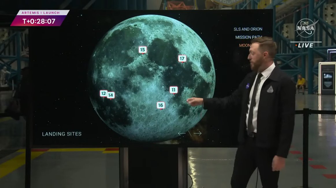 NASA's Dan Huot stands in front of the Moonboard during the broadcast of the launch of Artemis 1.