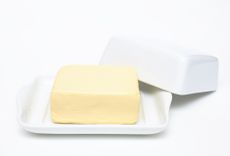 Butter sits in a butter dish.