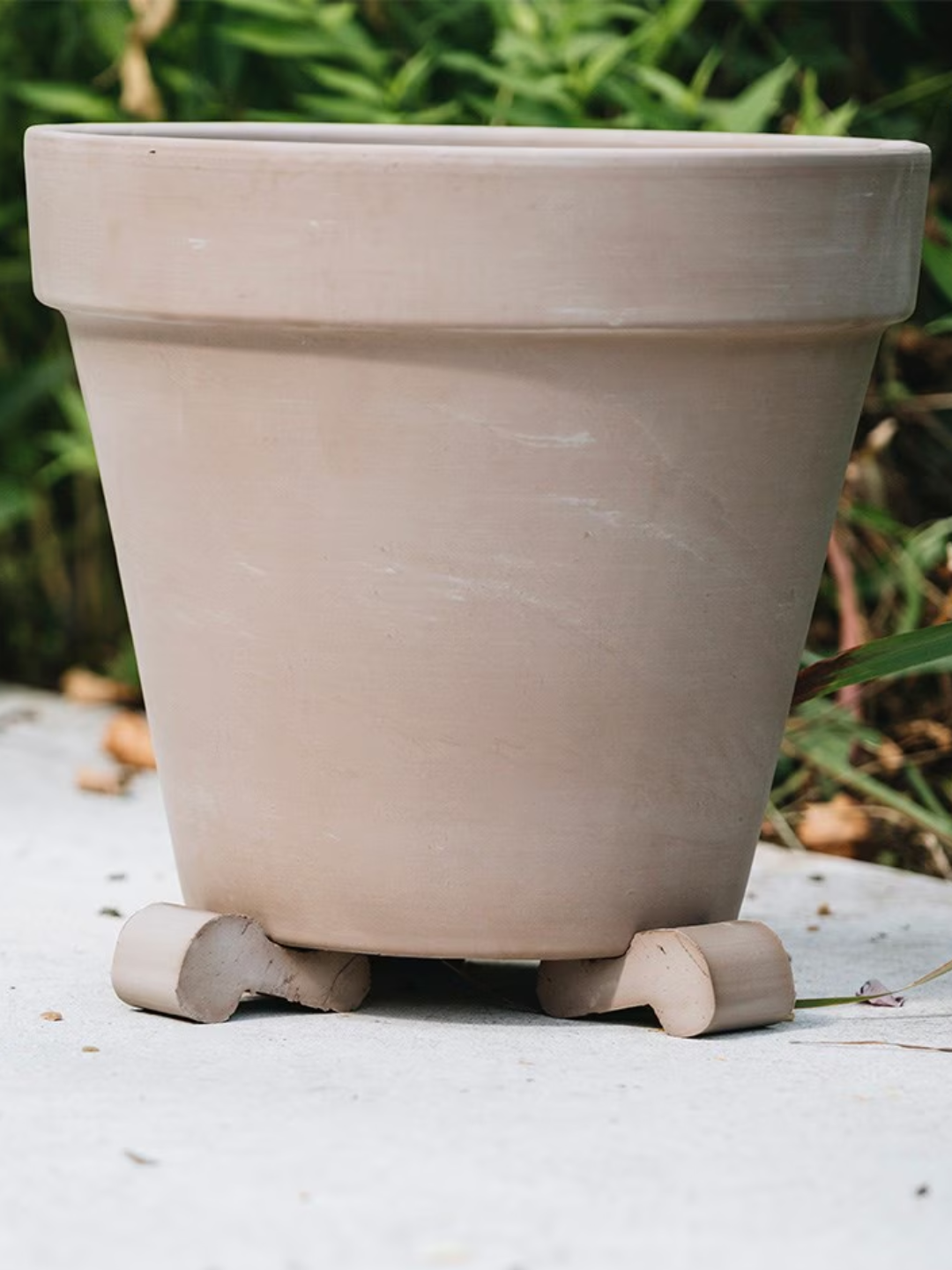 A set of three terracotta planter feet from RHS