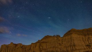 The constellation of Andromeda with the famous Andromeda Galaxy (Messier 31) rising on an early summer night at Dinosaur Provincial Park, Alberta in 2022.