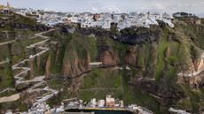 A photograph of the town of Fira above a cliff on Santorini island, taken on February 3, 2025, during the earthquake swarm. 