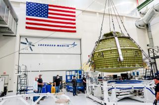 The Orion crew module pressure vessel for NASA's Artemis 3 moon mission undergoes assembly at the agency's Kennedy Space Center in Florida. 