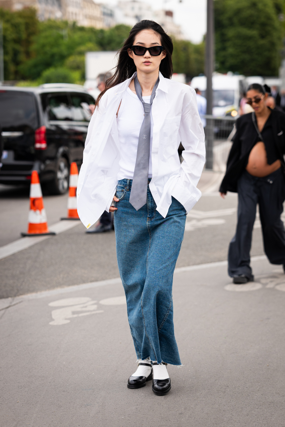 woman wearing black mary janes jeans and shirt