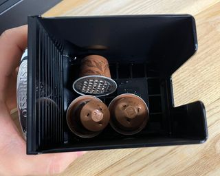 Spent OriginalLine Nespresso pod in Nespresso Citiz espresso maker capsule container bin