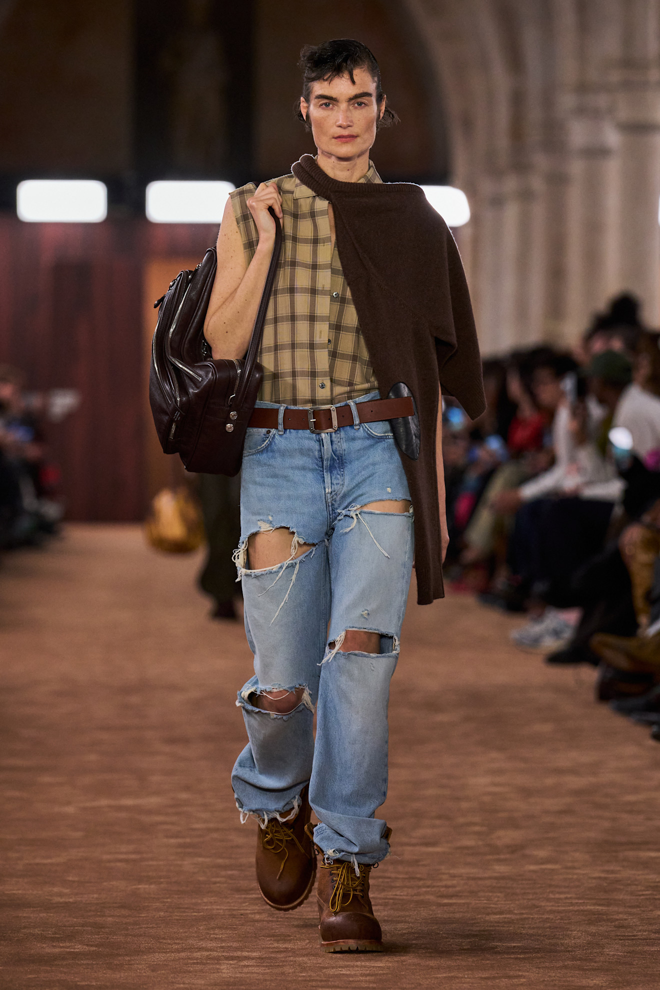 A model wore ripped jeans on the Acne Studios spring 2026 runway