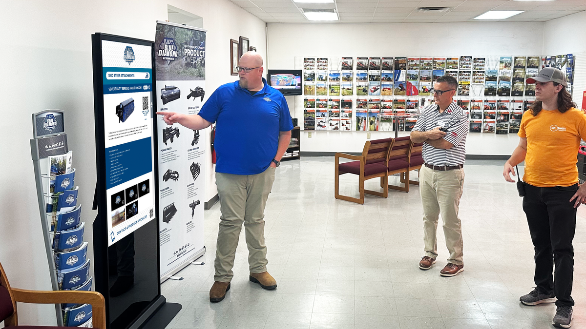 An employee from Blue Diamond using Red Dot Digital Media kiosks. 