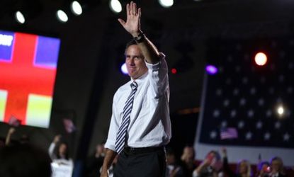 Mitt Romney greets supporters during a campaign rally in Jacksonville, Fla.