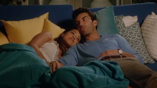Jane and Rafael laying on the couch together in Jane the Virgin.