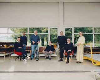 Giulio, Giovanni, Giovanni, Danilo, Fabio, Lorenzo and Maria Porro photographed at the Porro headquarters in Montesolaro with the brand’s ‘Romby’ chairs, designed by GamFratesi