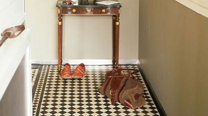 hallway with chequered tiles and flower vase