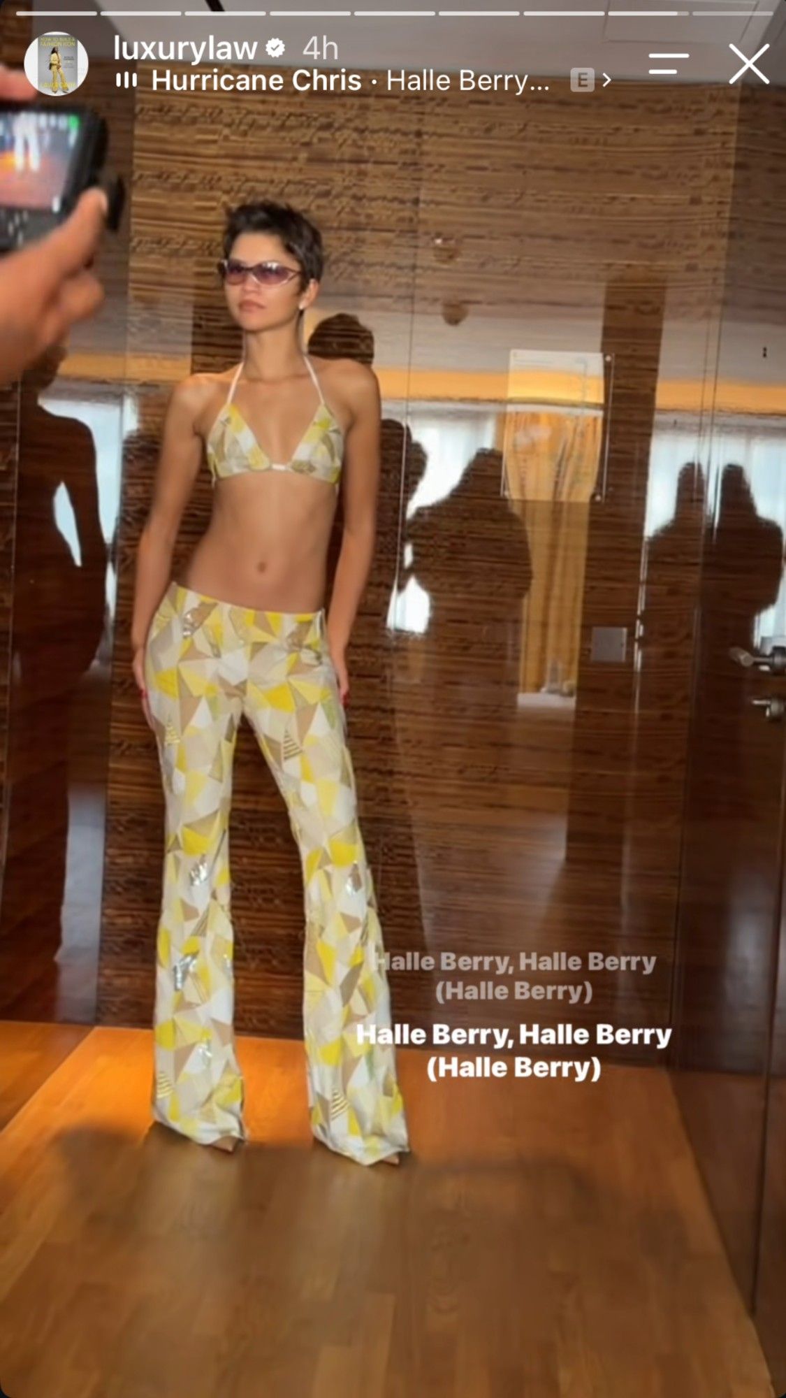 Zendaya wearing a yellow, silver and white bikini top and matching bootcut pants, recreating Halle Berry's look from the X-Men premiere.