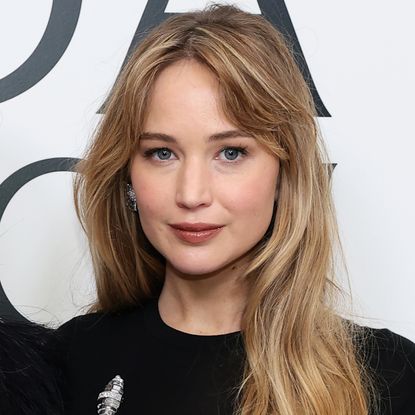 Jennifer Lawrence attended the CFDA awards wearing a black t-shirt dress and a silver brooch