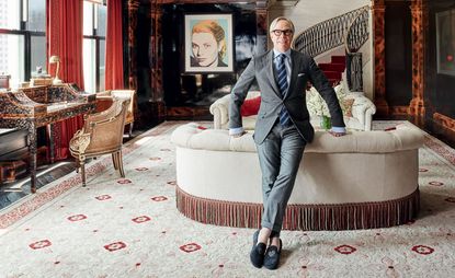 Hilfiger in the living room of his duplex penthouse at New York’s Plaza Hotel, with Warhol’s Grace Kelly