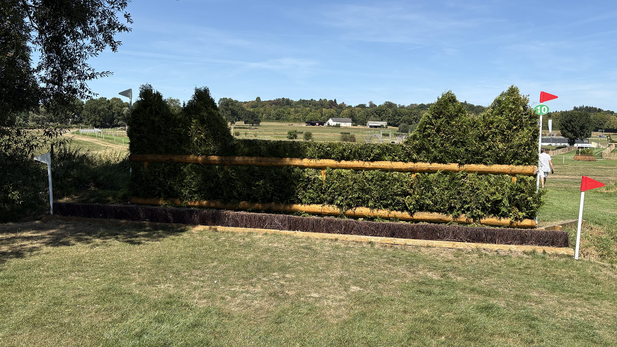 A brush fence with a ditch in front of it on the eventing World Championships cross-country course