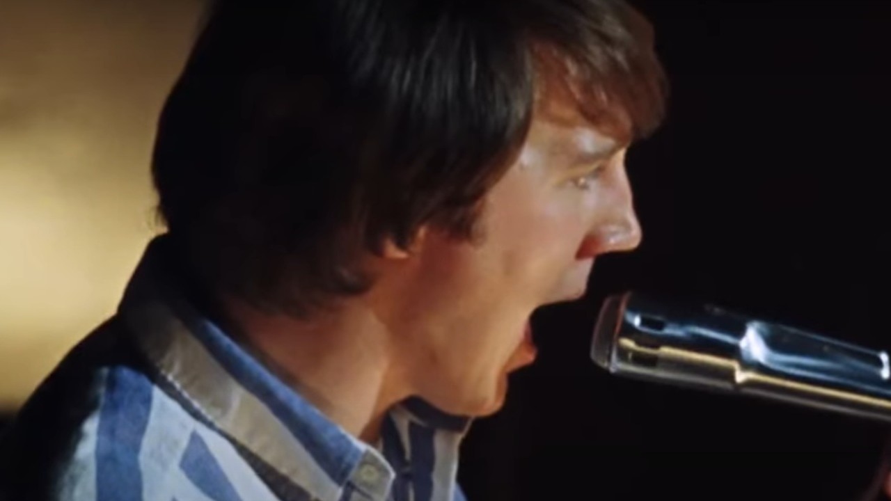 Paul Dano singing in front of a microphone in Love & Mercy