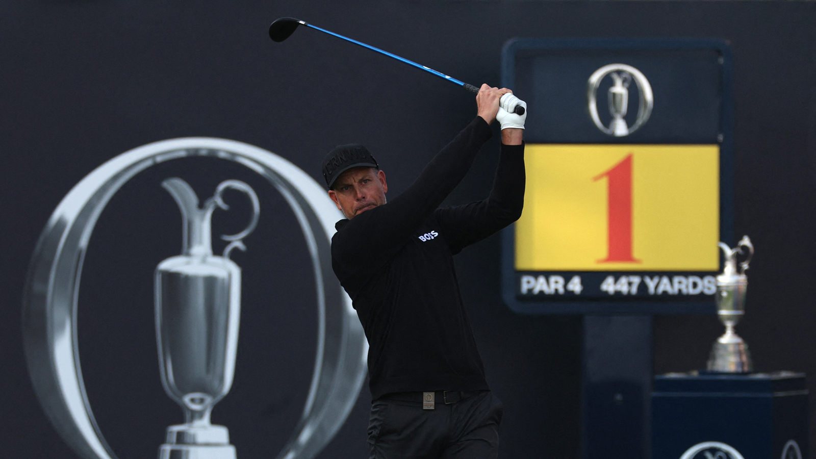 Henrik Stenson hits a tee shot at the opening hole of The Open