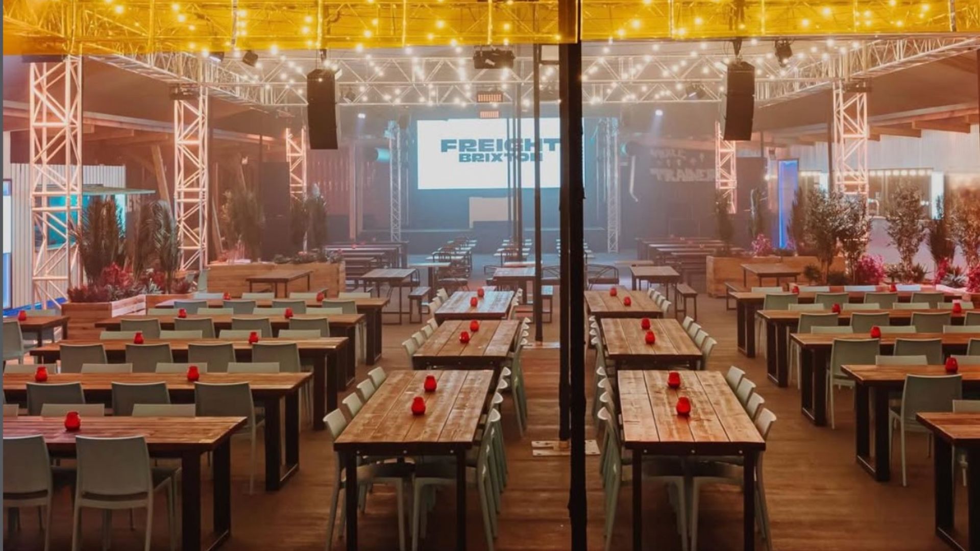 an image of the indoor set up of freight brixton with tables and festoon lighting