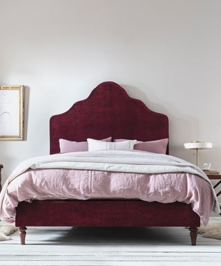 Luxe bedroom scheme with shapely Rococo inspired rouge headboard
