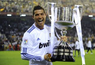 Cristiano Ronaldo celebrates with the Copa del Rey trophy after Real Madrid's win over Barcelona in the 2011 final.