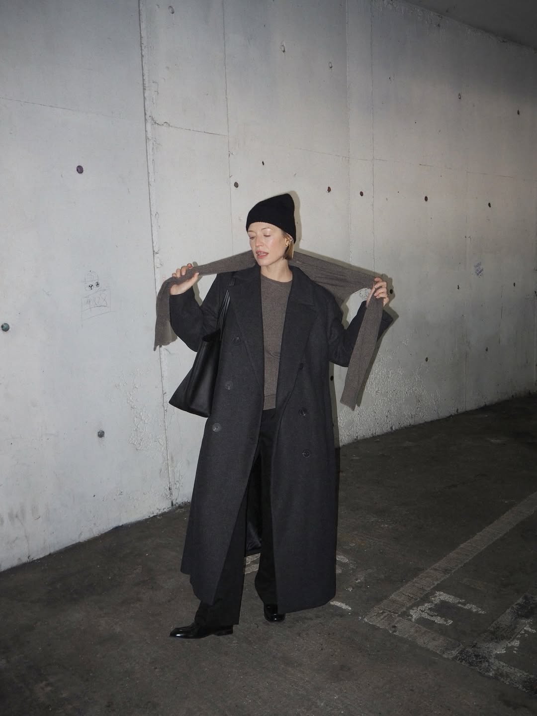 Image of Alexis posing for picture, wearing a classic, minimal outfit by InWear