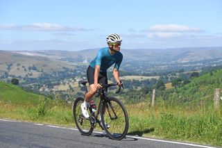 Image shows cyclist enjoying the ride
