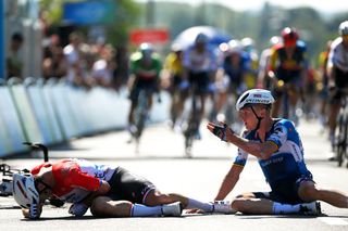 BILZEN BELGIUM AUGUST 28 LR Dylan Groenewegen of The Netherlands and Team Jayco AlUla and Tim Merlier of Belgium and Team Soudal QuickStep react after being involved in a crash at finish line during the 20th Renewi Tour 2024 Stage 1 a 1636km stage from Riemst to Bilzen UCIWT on August 28 2024 in Bilzen Belgium Photo by Luc ClaessenGetty Images