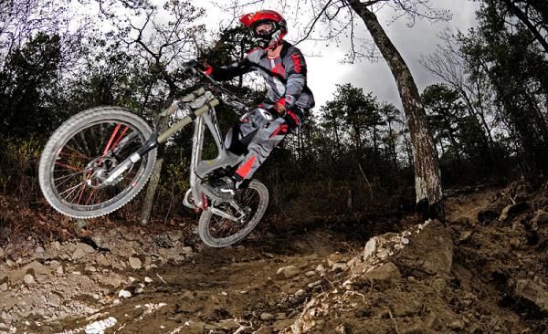 Sam Skidmore rips the new hip jump leading down to final rock garden