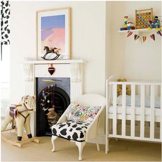 nursery with white walls and cradle