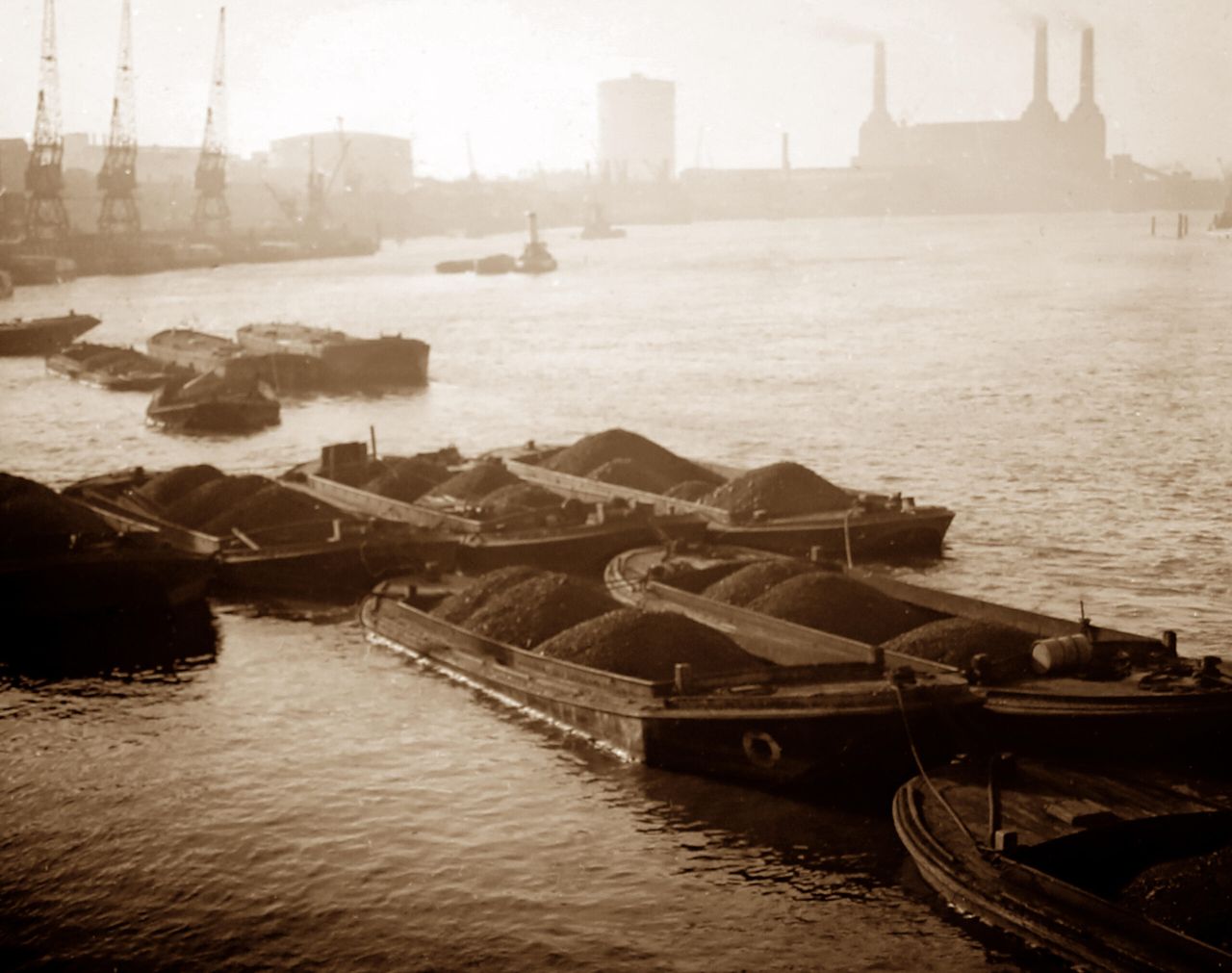 Coal barges on the Thames at the turn of the 20th century.