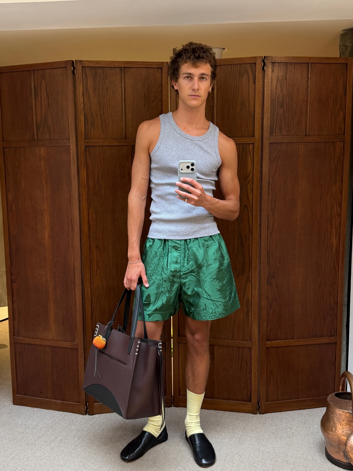 An image of @finnnthomas wearing a JW Anderson bag.