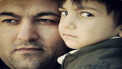 Ghader Ghalamere with his son