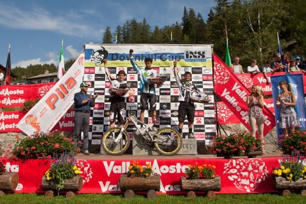 The elite men's podium at the iXS Downihll Cup in Pila Gressen, Italy