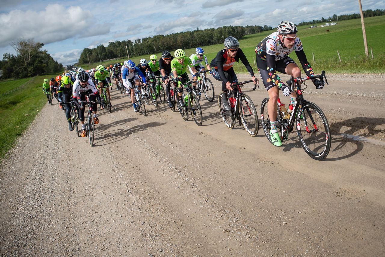 The peloton hits the dirt sector during stage 3 in Alberta