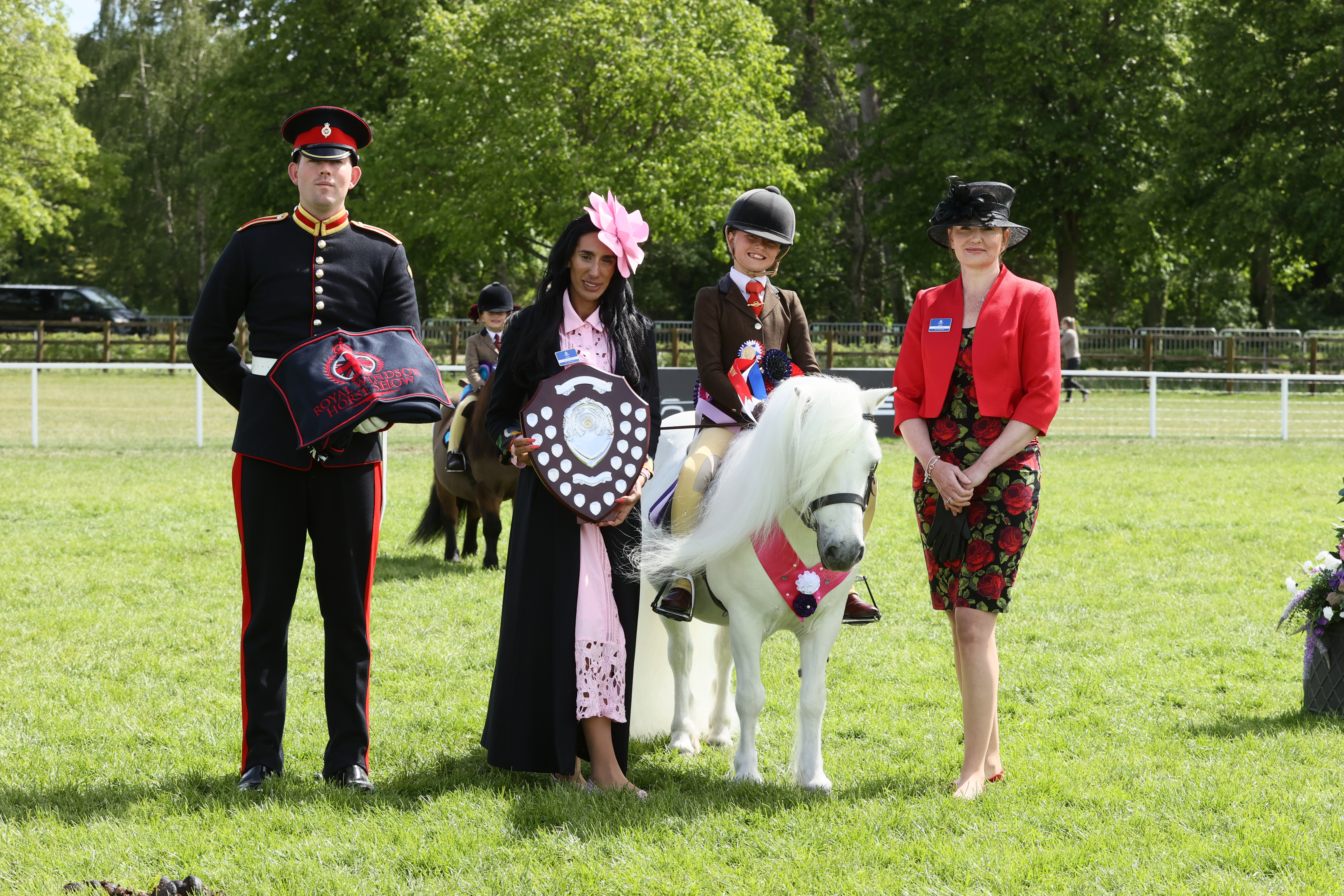Briar Snowman and Penny Richardson stand for a photo after they land the 2026 Royal Windsor senior ridden championship