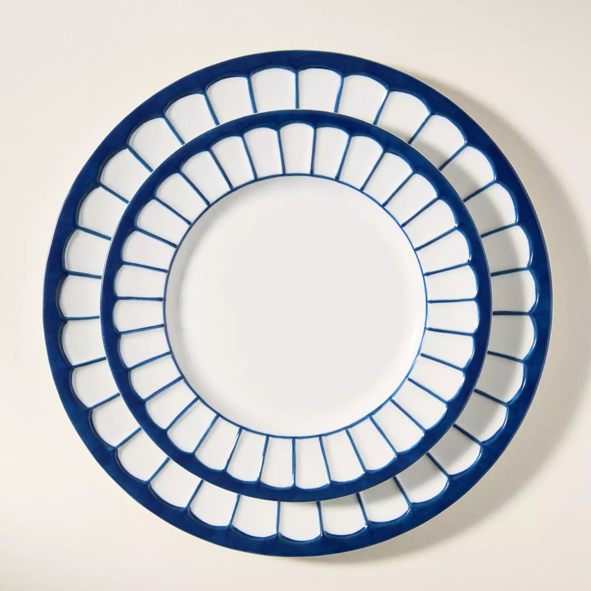 Blue and white side plates with thick blue rim