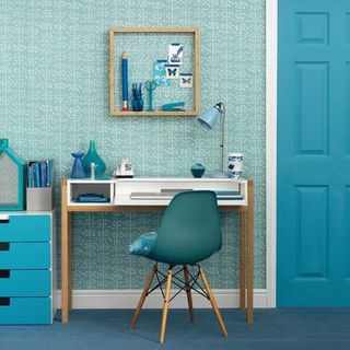 blue office room with wallpaper and table
