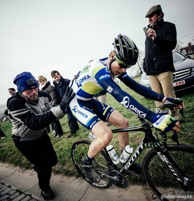 A GreenEdge rider makes use of a push