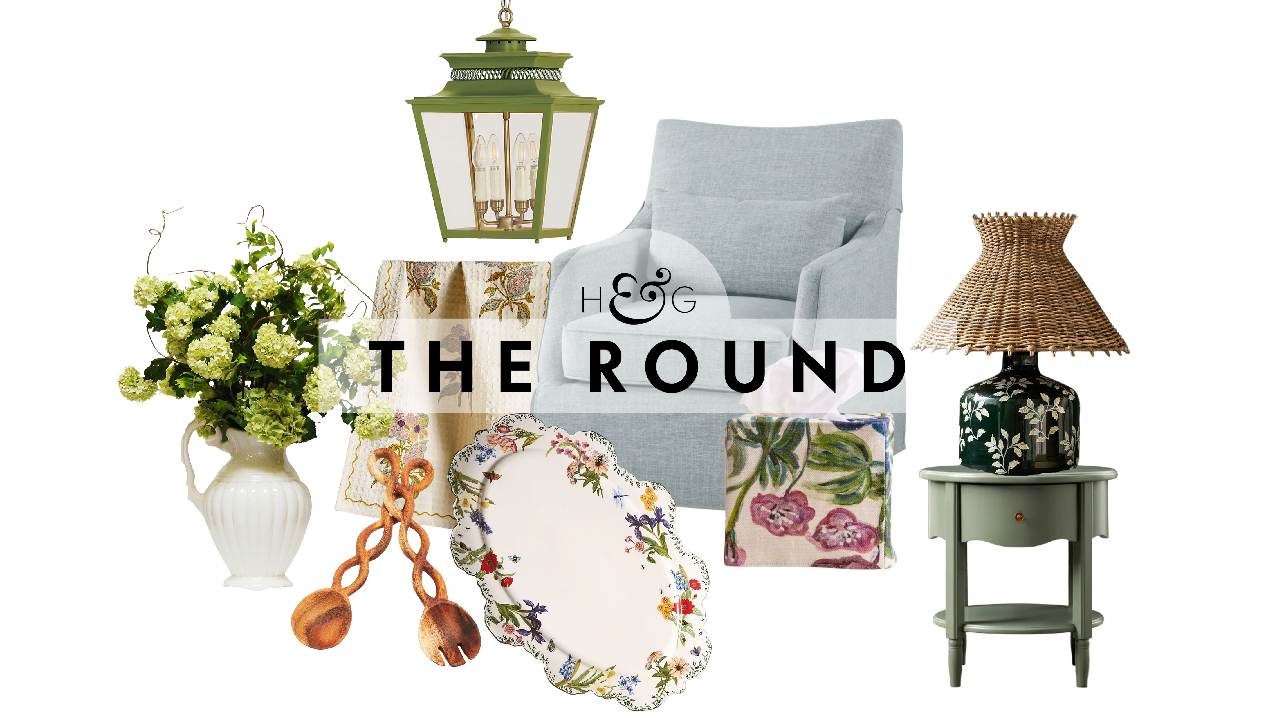 Nancy Meyers spring decor, including a vase of hydrangeas, set of twisted wooden salad servers, green lantern pendant light, floral-bordered tray, and slipcovered accent chair, pictured against a white background.