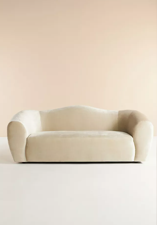 Curved Anthropologie sofa.