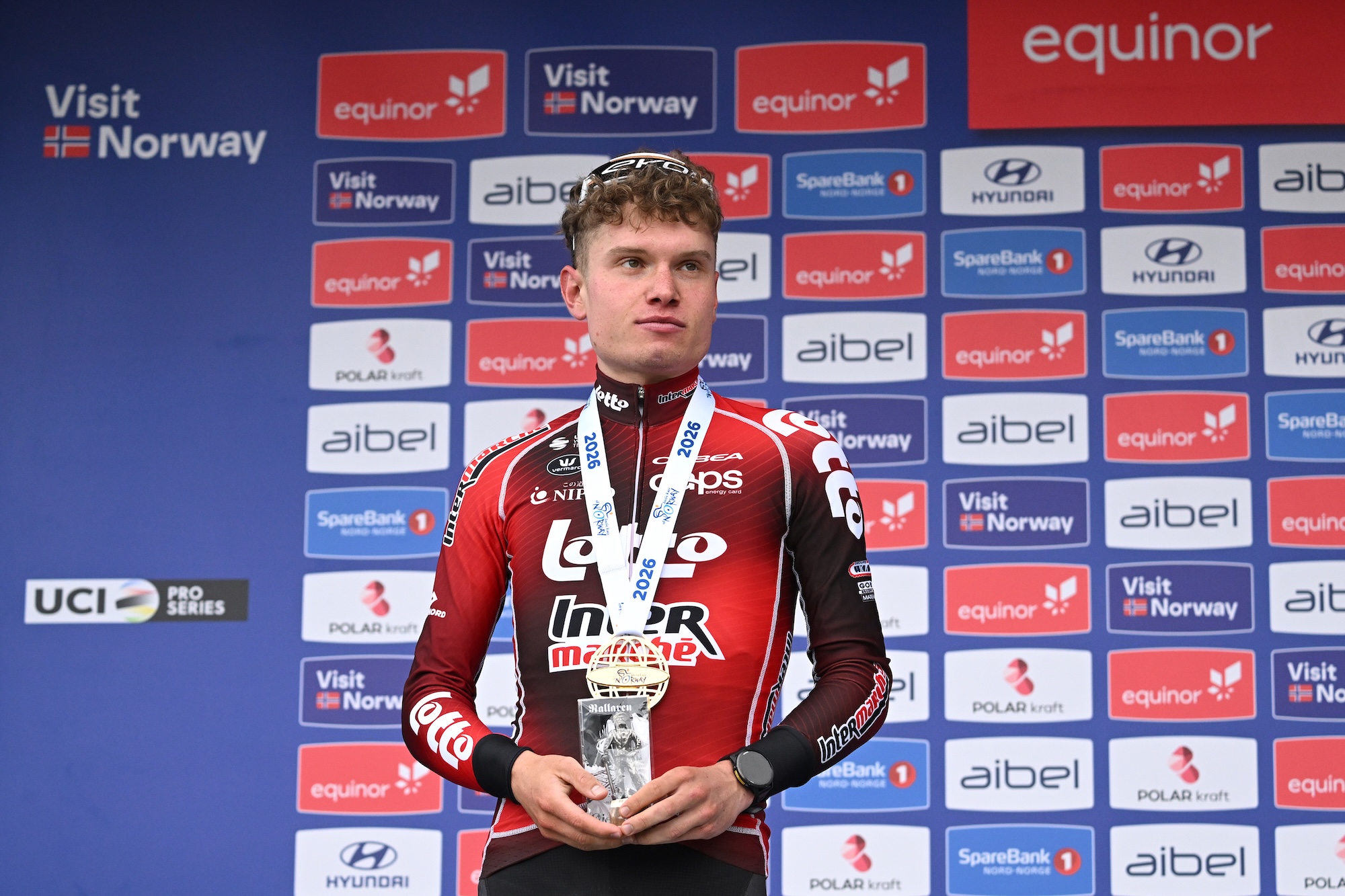 NARVIK, NORWAY - AUGUST 16: Lennert Van Eetvelt of Belgium and Team Lotto Intermarche on second place poses on the podium ceremony after the 13th Arctic Race of Norway 2026, Stage 4 a 190.5km stage from Sortland to Narvik 270m on August 16, 2026 in Narvik, Norway. (Photo by Dario Belingheri/Getty Images)