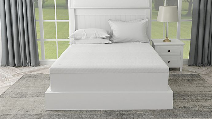 Best mattress toppers: The Therapedic Polar Nights 3 Inch Mattress Topper placed on a white mattress on a white wooden bed frame