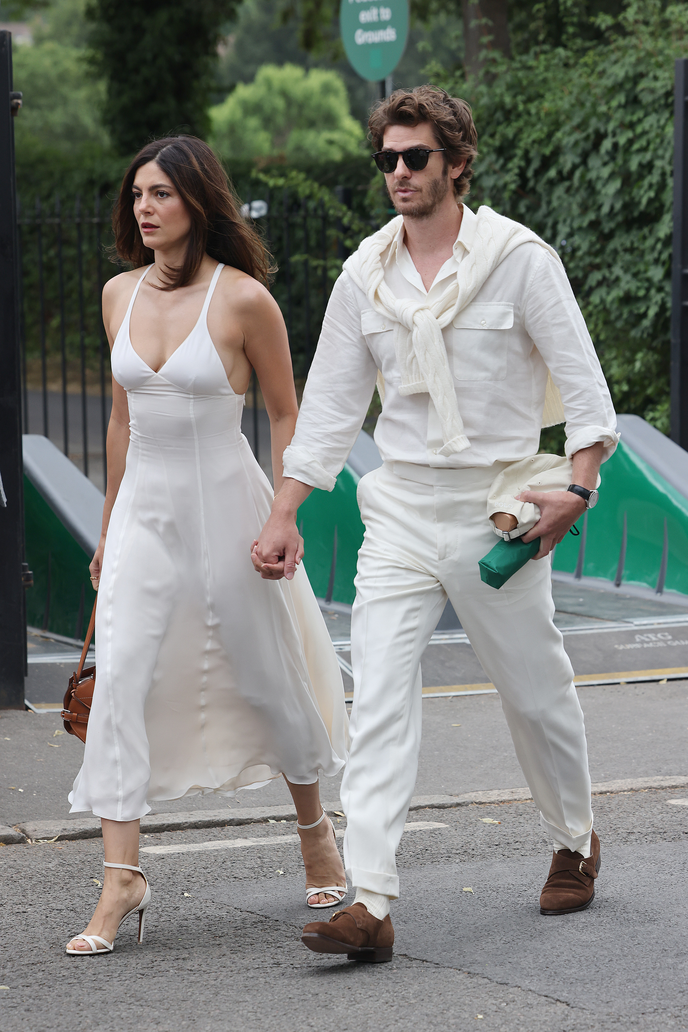 Monica Barbaro and Andrew Garfield at Wimbledon in all-white outfits